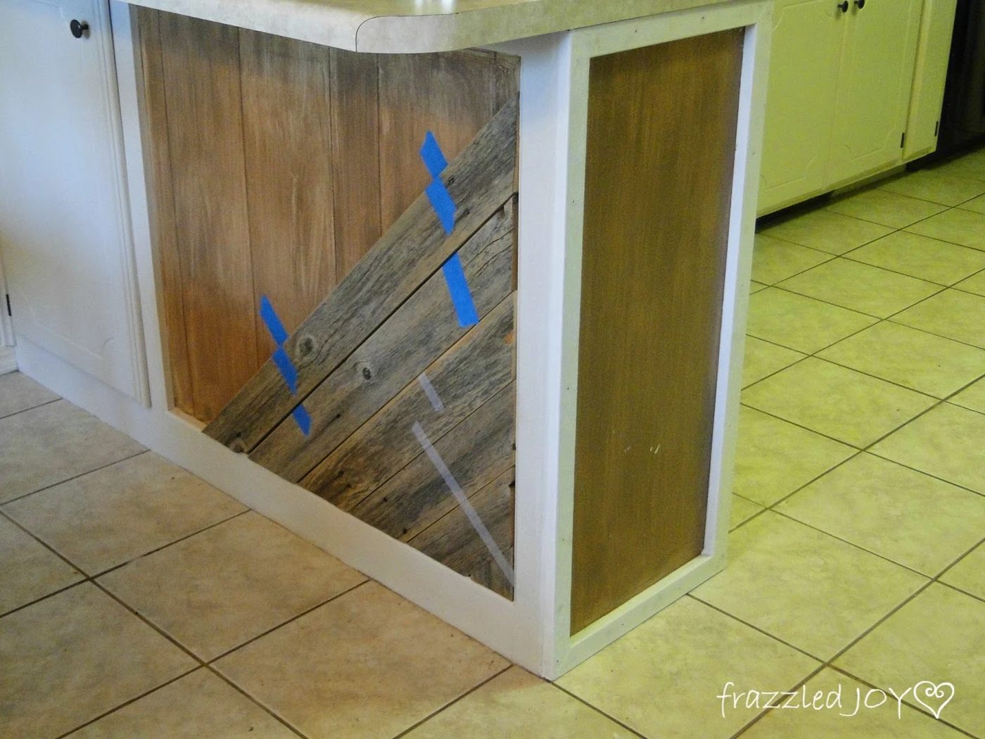 use painter's tape to hold planks to kitchen island, Frazzled Joy on Bekob
