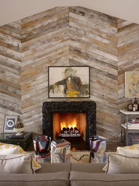 large wood plank accent wall with fireplace