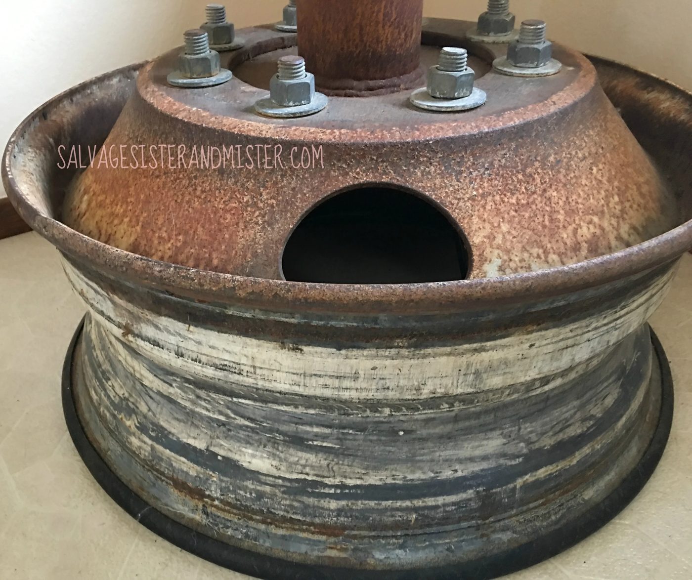 Tire rim upcycled as base in salvaged material bar-height industrial table by Salvage Sister and Mister featured on @Bekob
