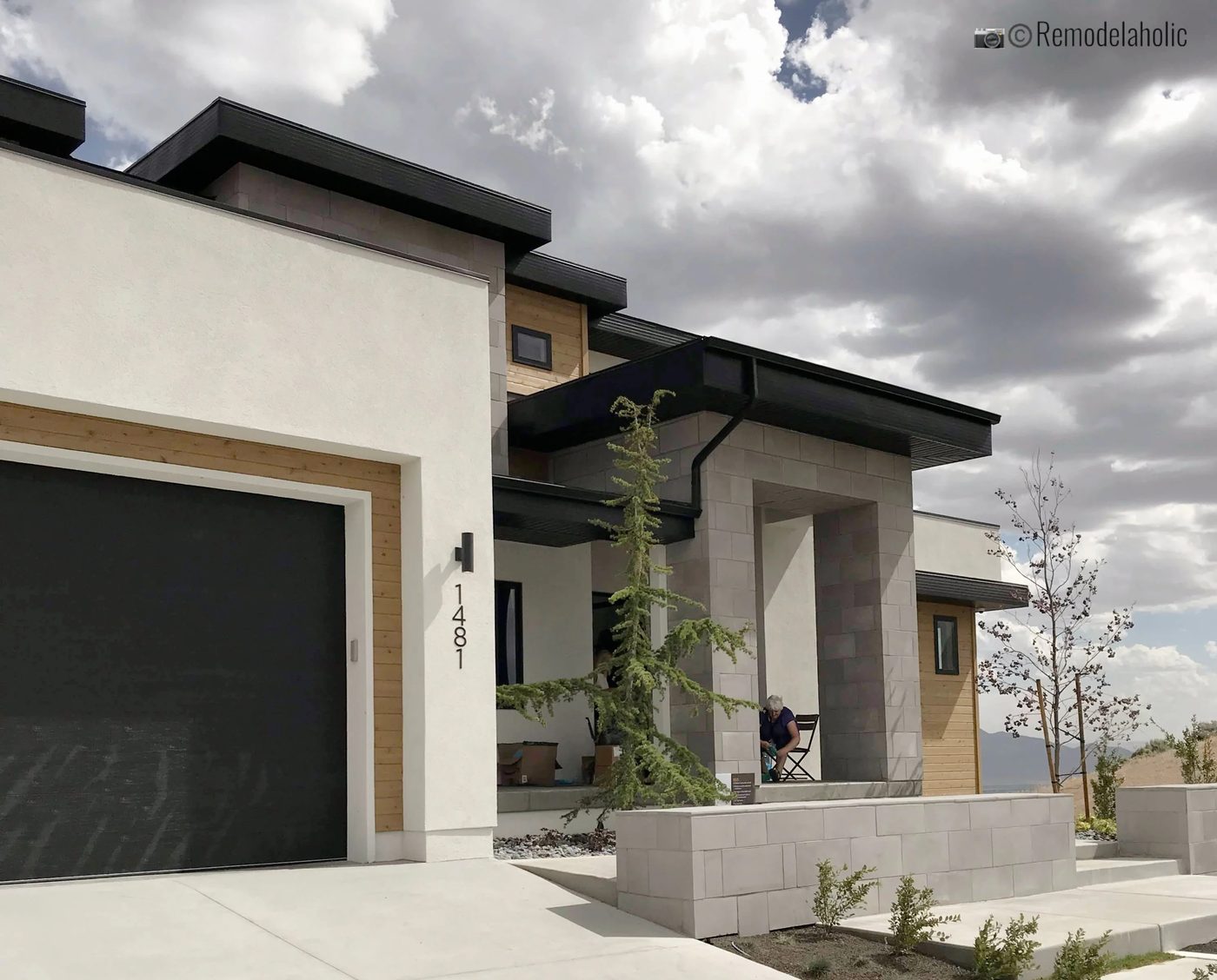 Black sleek modern sconces for modern home exteriors, UVPH 2018 Home 28 Ezra Lee Design+Build, Photo by Bekob