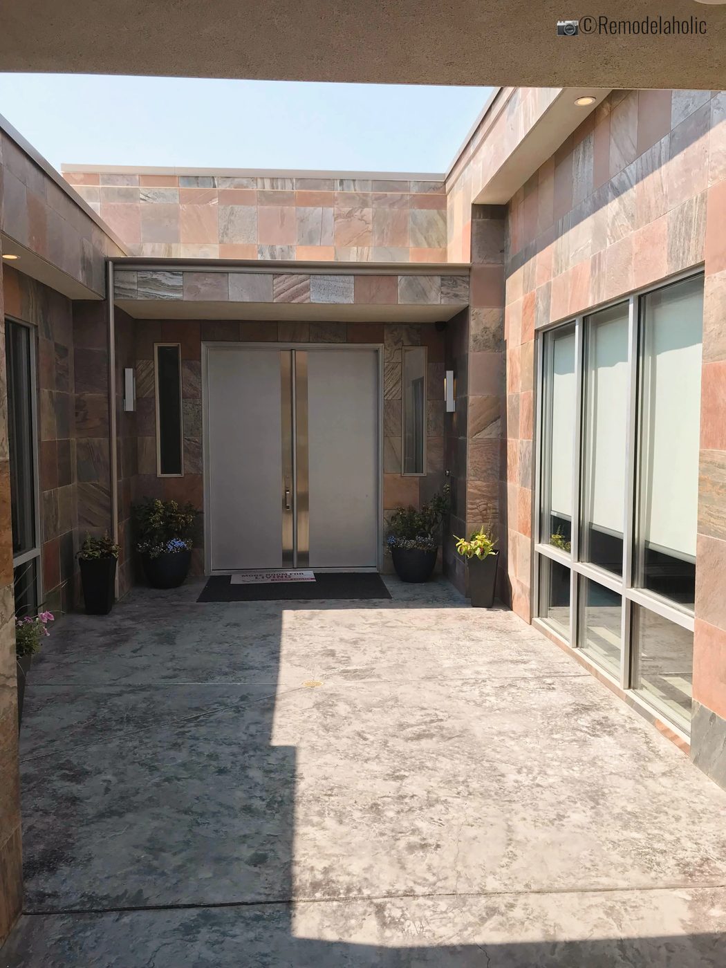 Front door sconces in modern chrome style. SLPH 2018 Home 3 Breen Homes, Photo by Bekob