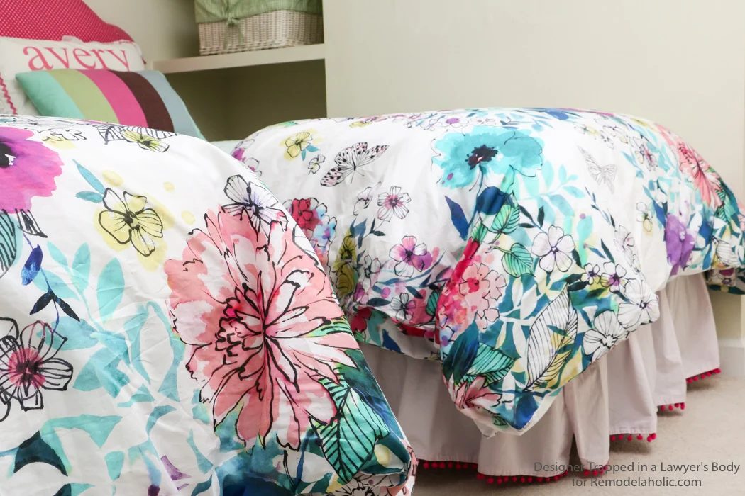 Embellished bed skirts are expensive! If you are on a modest-cost, create this semi-homemade pom pom bedskirt without breaking the bank. It's a high-end look on a modest-cost!