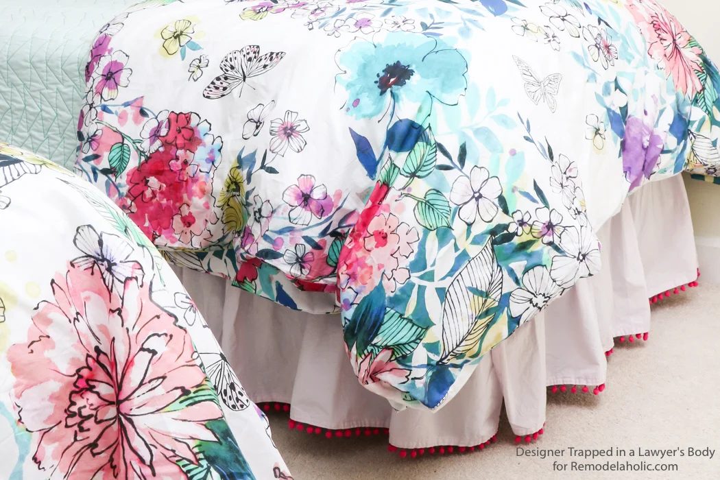 Embellished bed skirts are expensive! If you are on a modest-cost, create this semi-homemade pom pom bedskirt without breaking the bank. It's a high-end look on a modest-cost!