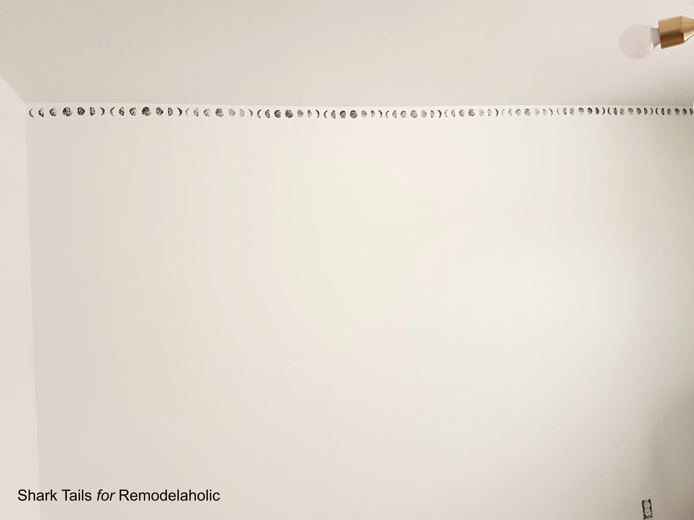 Handmade lunar cycle stamped accent wall for a gender neutral baby nursery | Paint this entire wall in one day and save hundreds of dollars over buying hand-painted wallpaper