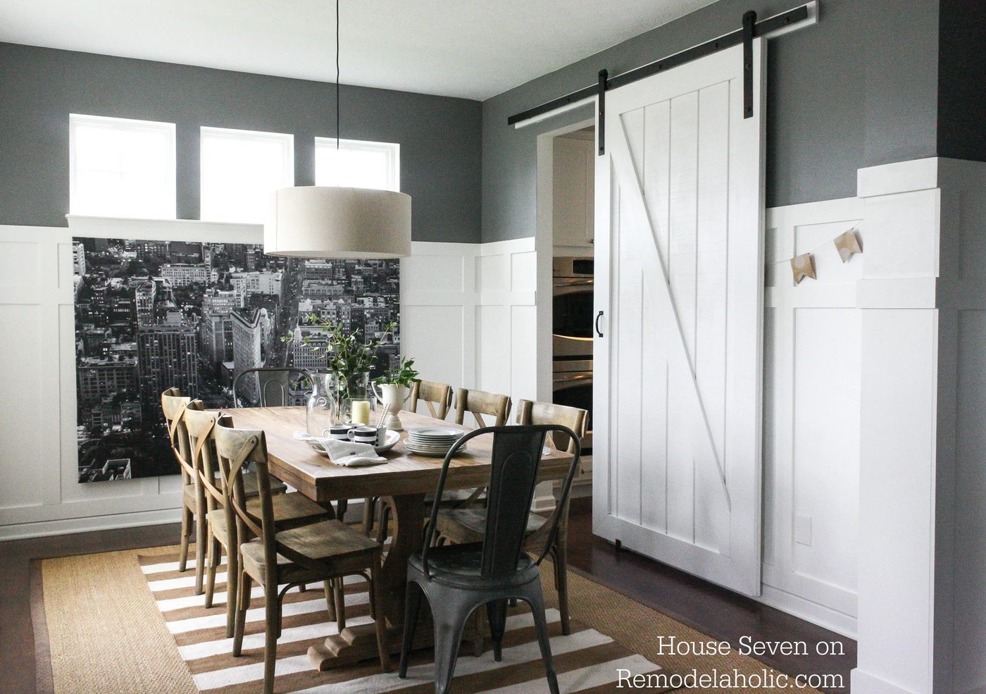 Build a striking sliding barn door with great detail using siding! Free plans and walkthrough on @Bekob