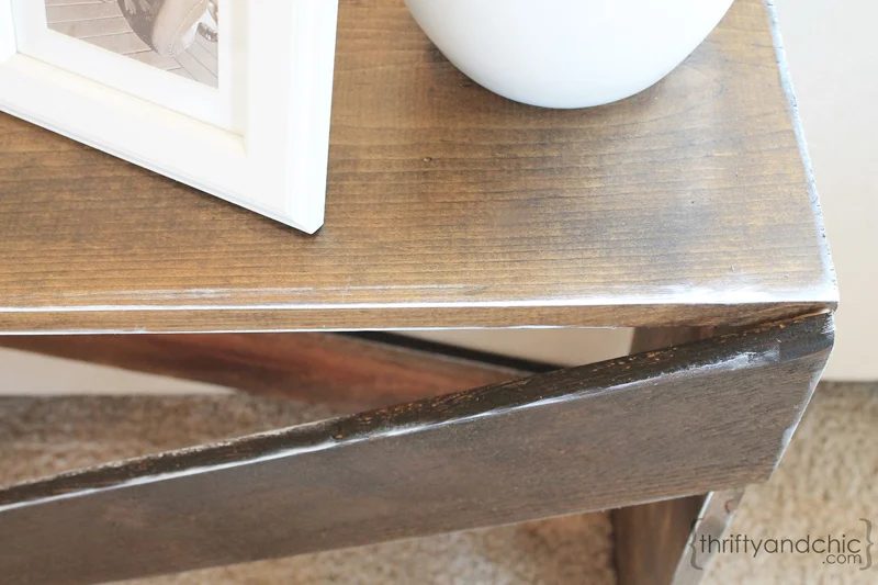detail of white distressing on X-base sofa table, featured on Bekob.com