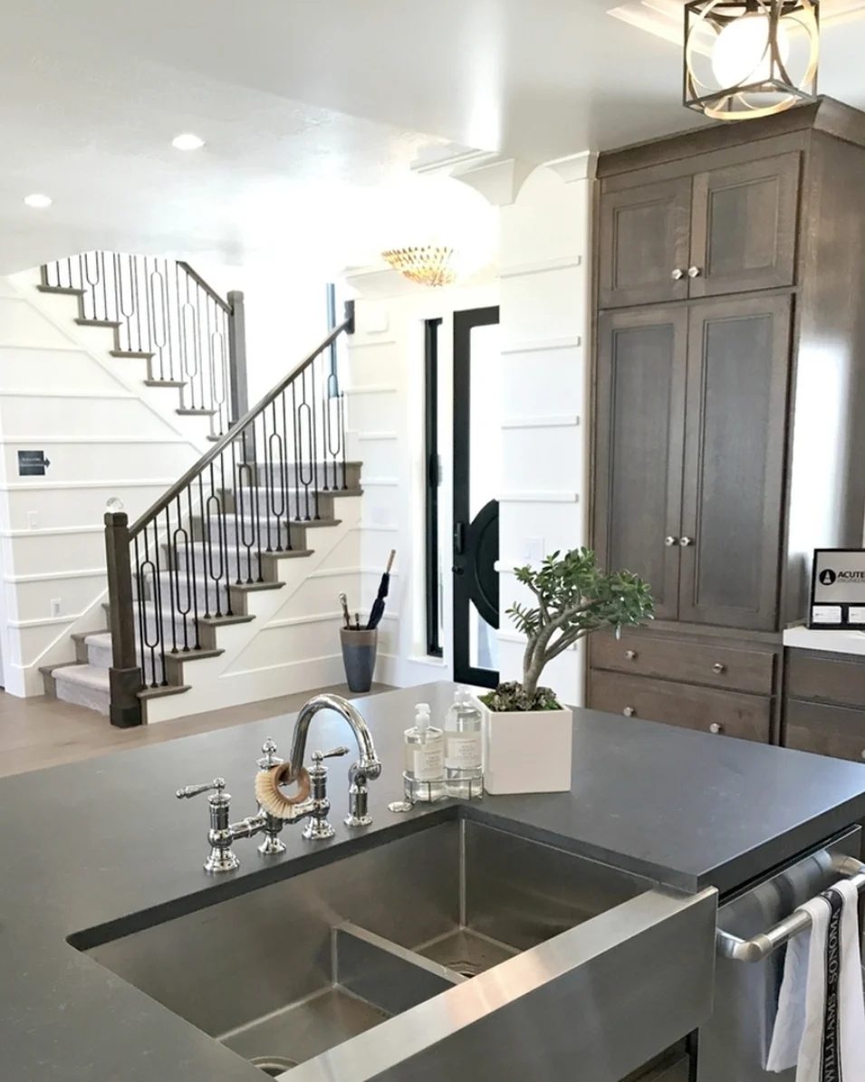 View Through Kitchen To Stairs, White Walls, Wood Cabinets, Stainless Steel