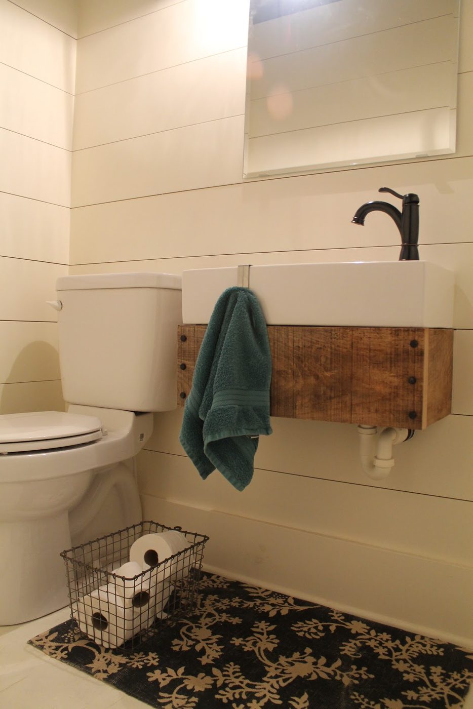 Girl Meets Carpenter bathroom makeover with wooden floating sink pedestal