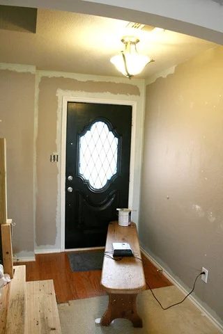 Entry updates black door white moldings entry table columns (25)