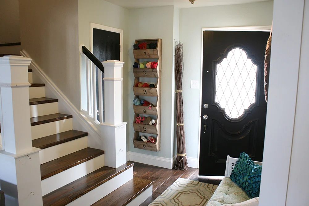 Entry updates black door white moldings entry table columns (28)