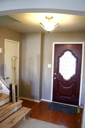 Entry updates black door white moldings entry table columns (16)