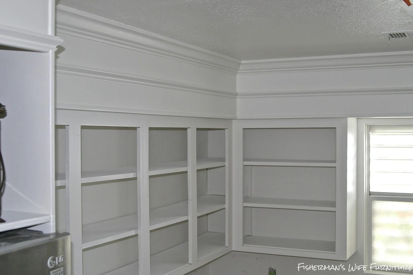 white painted kitchen cabinets with molding, Fisherman's Wife Furniture featured on Bekob.com