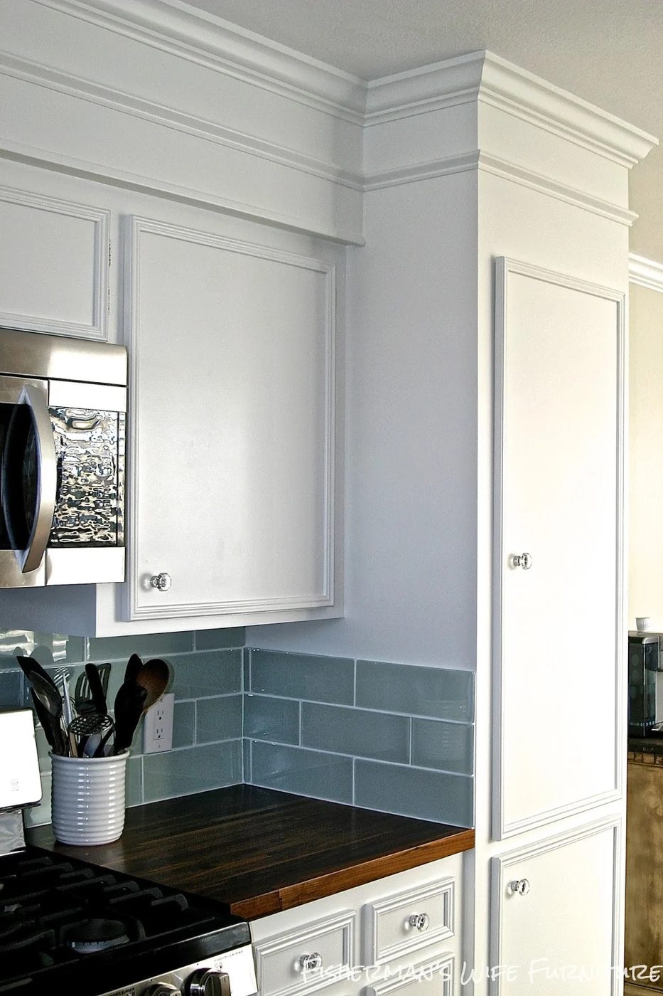glass knobs and molding on white kitchen cabinets, Fisherman's Wife Furniture featured on Bekob.com