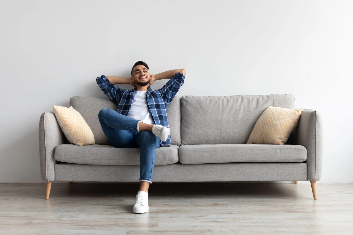 Man Sitting On Couch