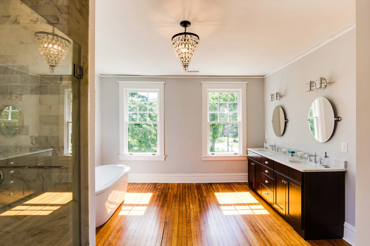 (Hawthorne) spacious open bathroom with wood floor, painted in Benjamin Moore O-Zone Blue @Bekob