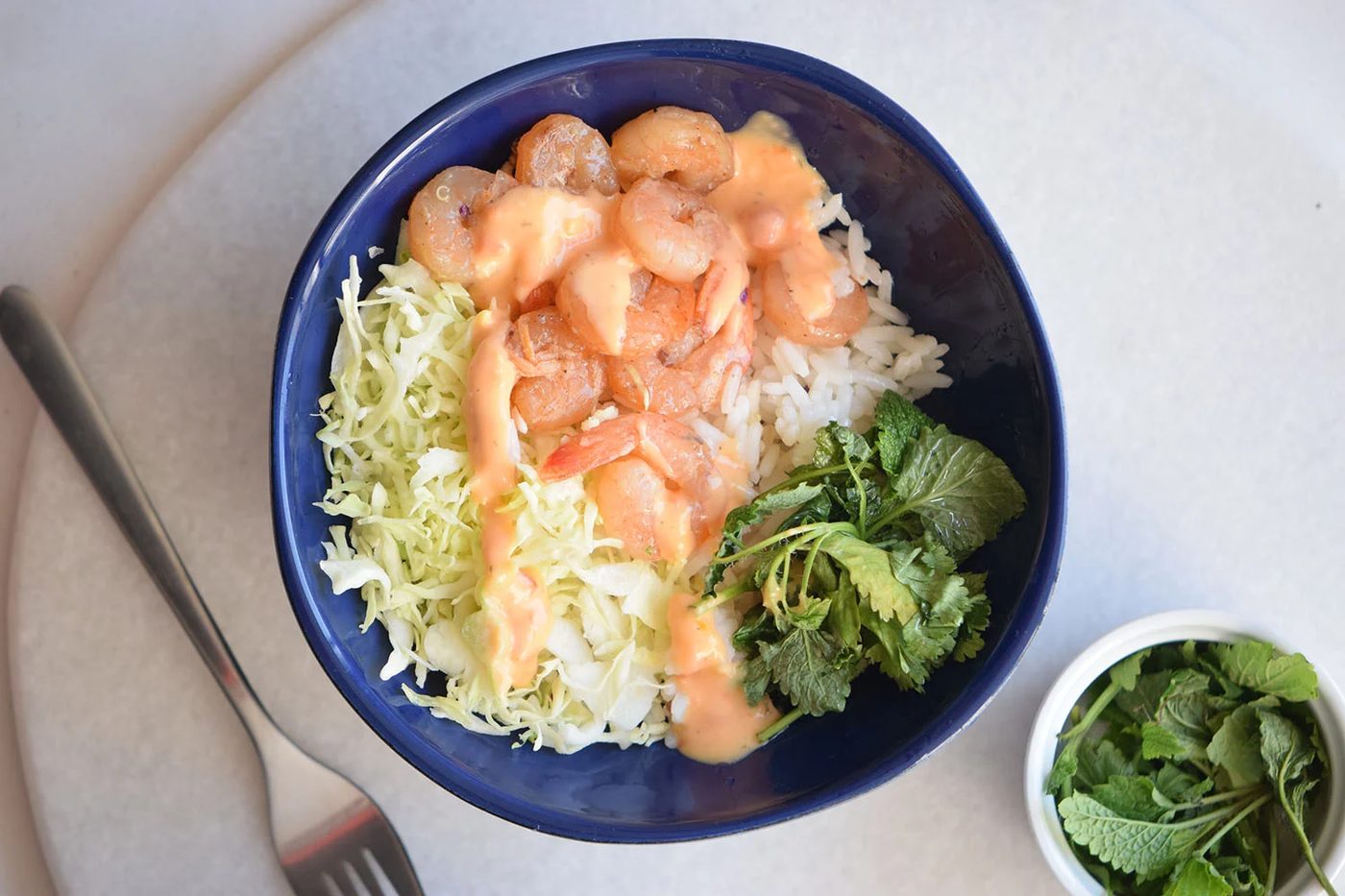 Looking for a yummy and straightforward recipe? Try this spicy shrimp bowl via Bekob.com