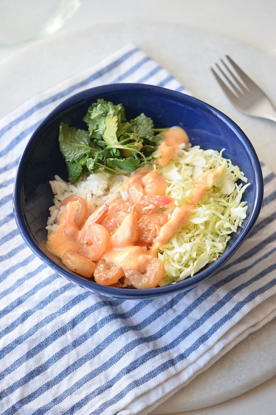 Looking for a yummy and straightforward recipe? Try this spicy shrimp bowl via Bekob.com