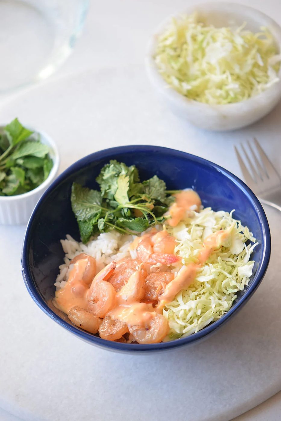Looking for a yummy and straightforward recipe? Try this spicy shrimp bowl via Bekob.com