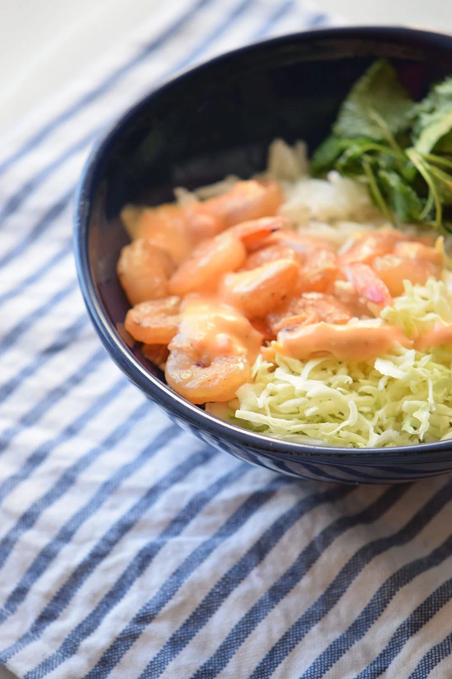 Looking for a yummy and straightforward recipe? Try this spicy shrimp bowl via Bekob.com