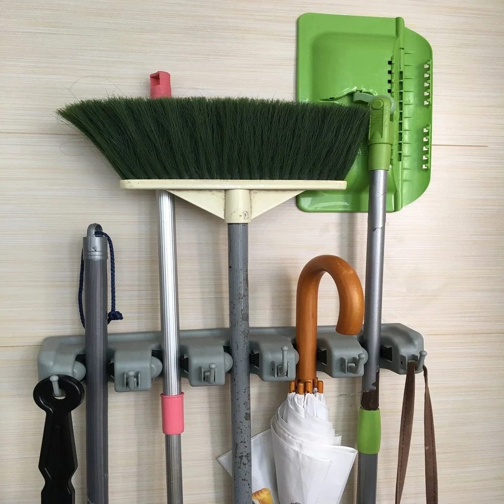 Organize mops and brooms inside, or shovels, rakes, and tools outside!