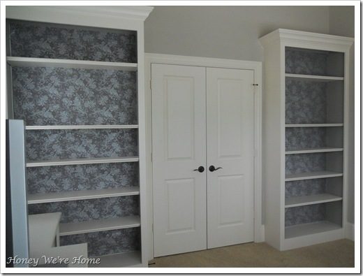 Spruce Up Your Built-in Bookshelves With A Fabric Backdrop