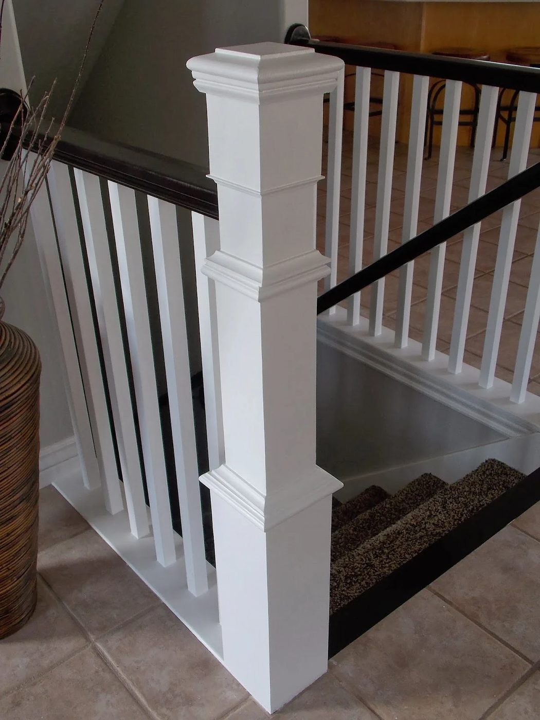 how to build a newel post around an existing banister - TDA Designs featured on @Bekob