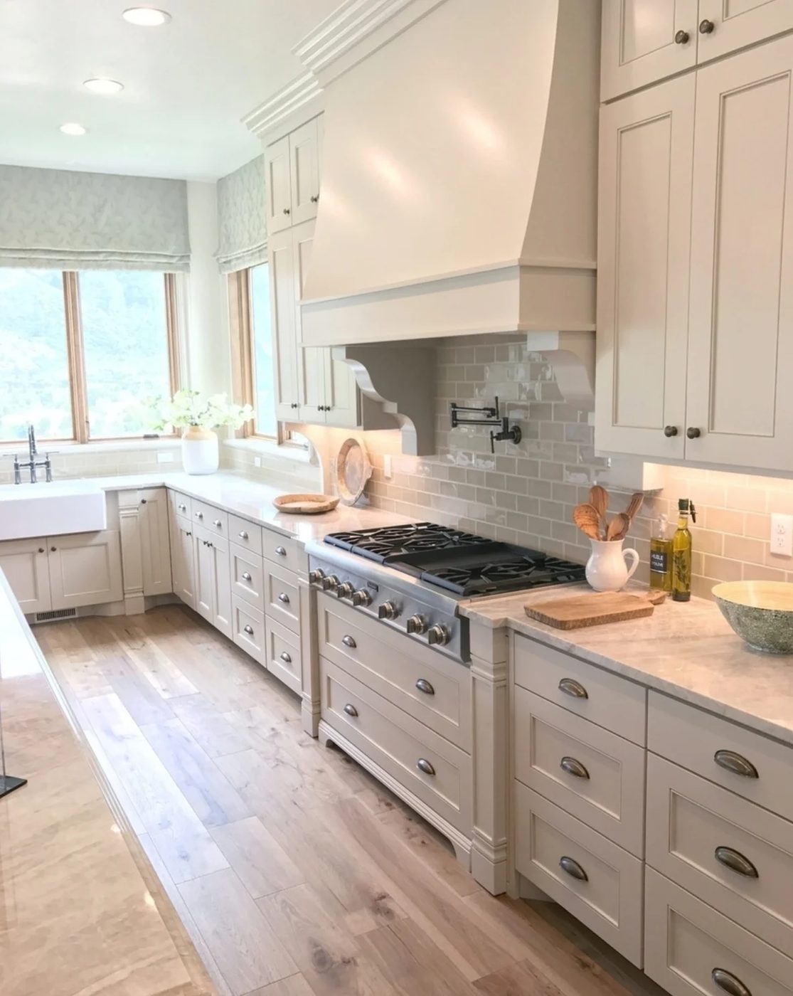 Large Grey Color Schemed Kitchen With Wood Floors And Granite Countertops