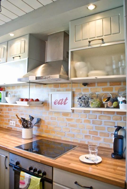 Tiny Kitchen Renovation With Faux Painted Brick Backsplash And Wooden Counters And Open Shelves