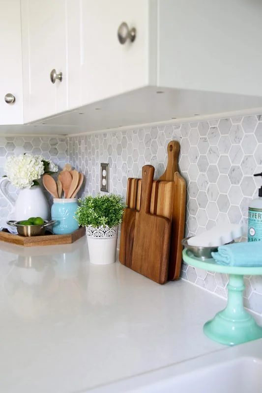 Neutral Backsplashes Image Of Kitchen With White Cabinets And Silver Handles And Grey Backasplash And Accents Of Wood And Torqouise