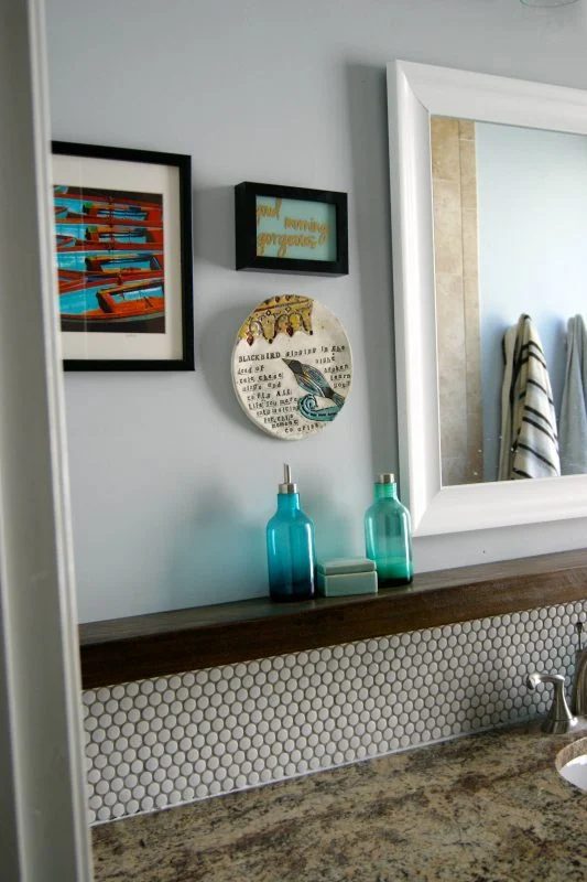 Bathroom Vanity With Penny Tile Backsplash And Floaring Shelf