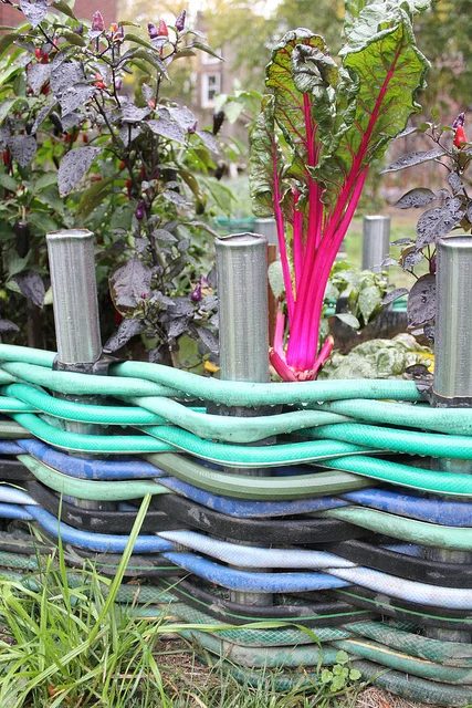 Recycle old hoses for a unique garden edging by Kara Paslay Designs featured on Bekob.com