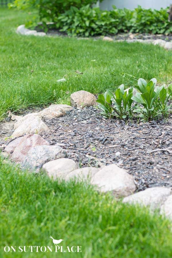 Larger rocks for a garden edge by On Sutton Place featured on Bekob.com