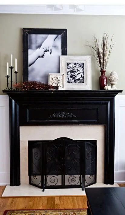 Classic black mantel with a striking arrangement of decor