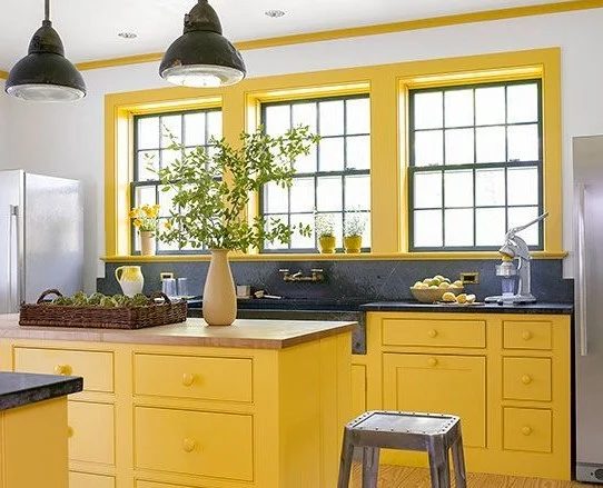 Bright yellow kitchen with soapstone counters via BHG | Yellow Kitchen Inspiration and decorating options #Bekob