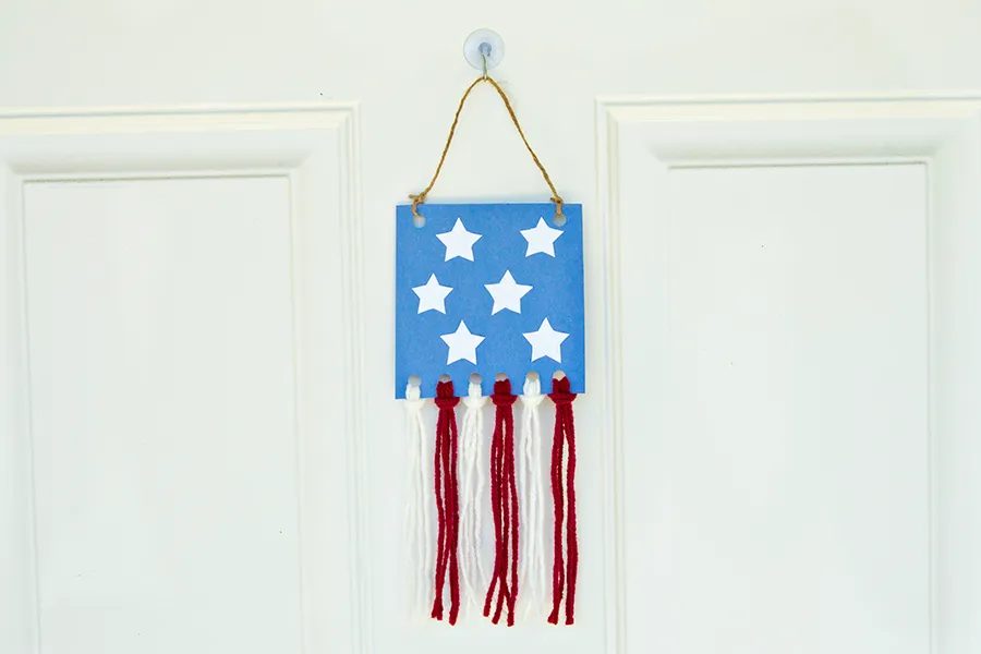 paper and yarn door decor.