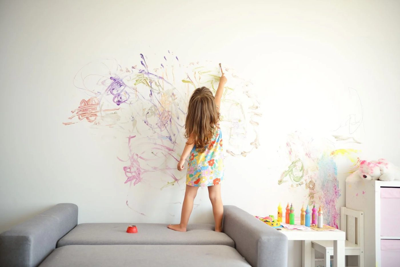 Little Girl Drawing Wall