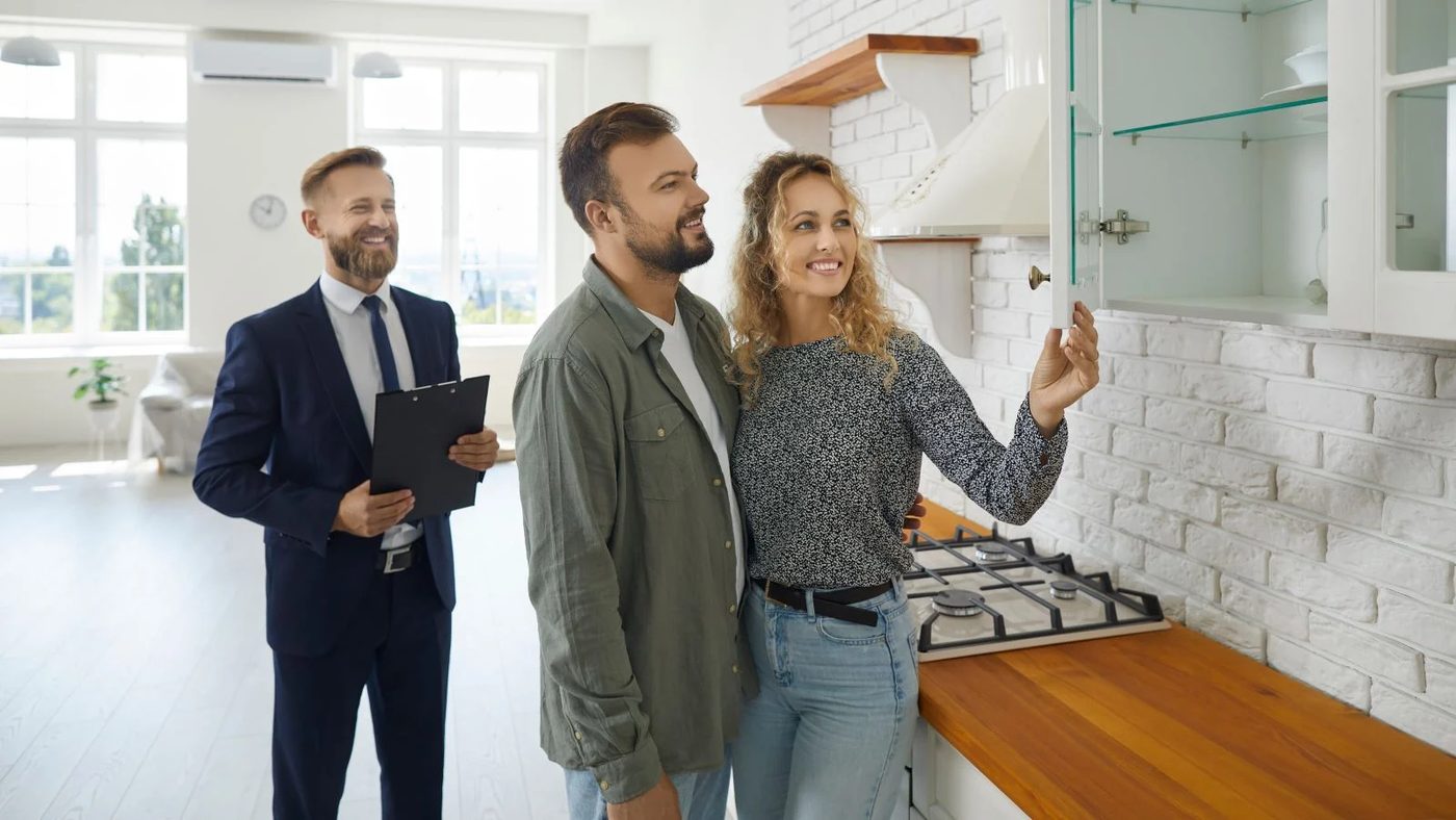 Couple Inspecting House