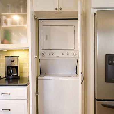 stacked washer and dryer in laundry closet in kitchen, Southern Living
