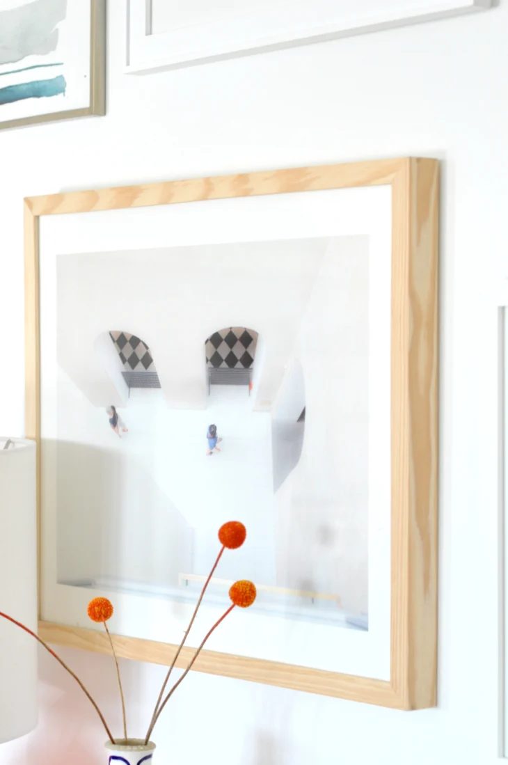 How to Create a Modern Balanced Gallery Wall by House Updated featured on Bekob