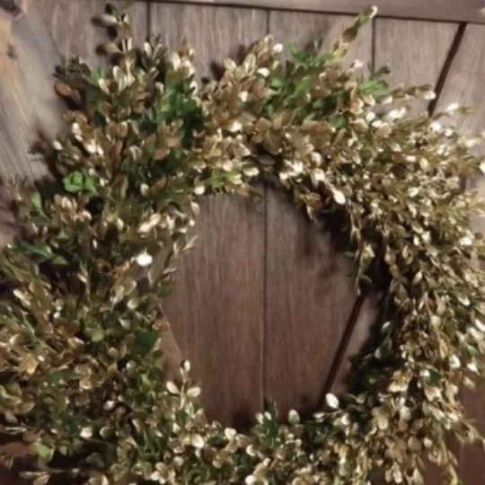 Boxwood Wreath With Gold Accents On Wooden Barn Door