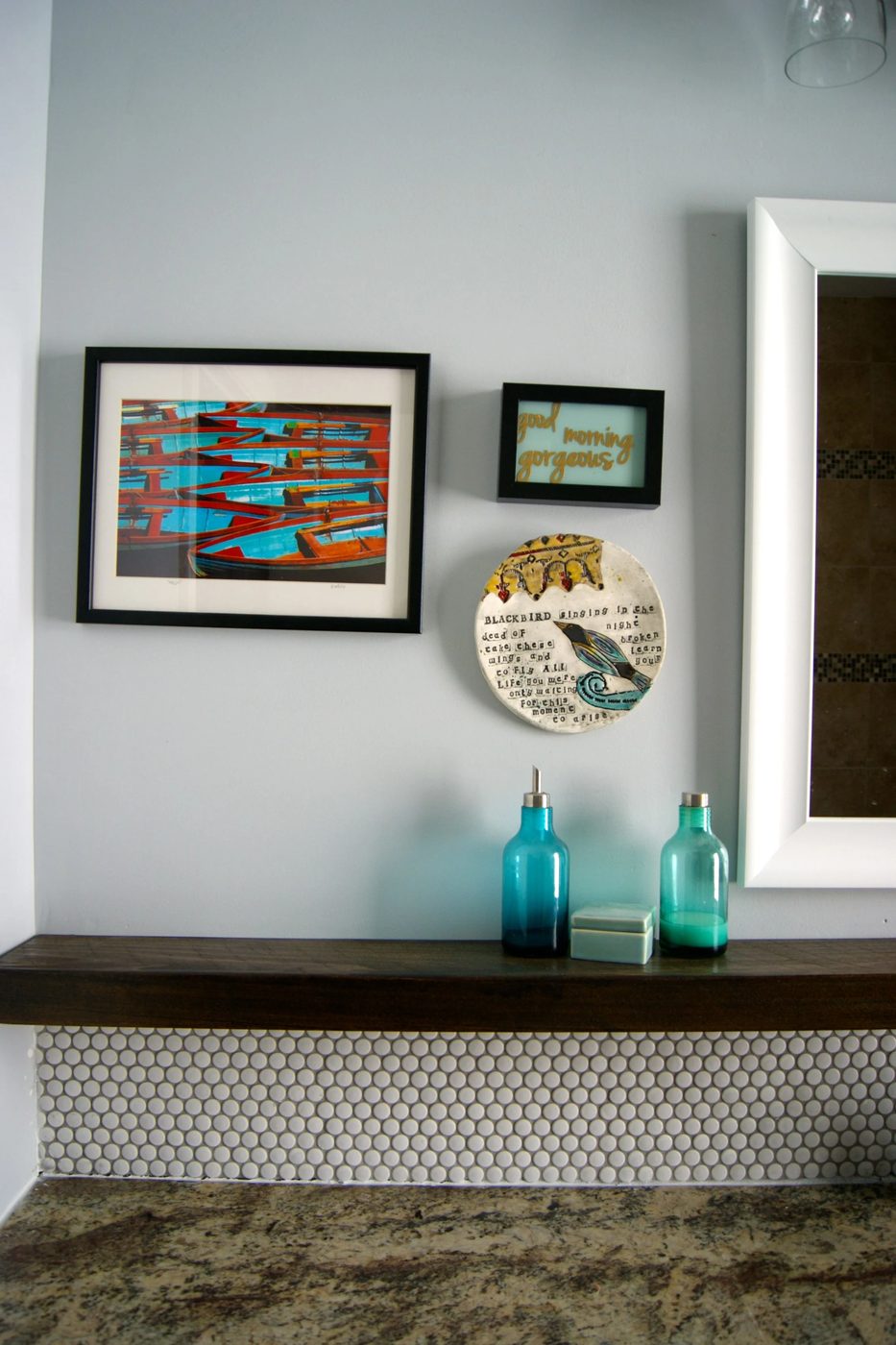 bathroom makeover with penny tile and floating wood shelf