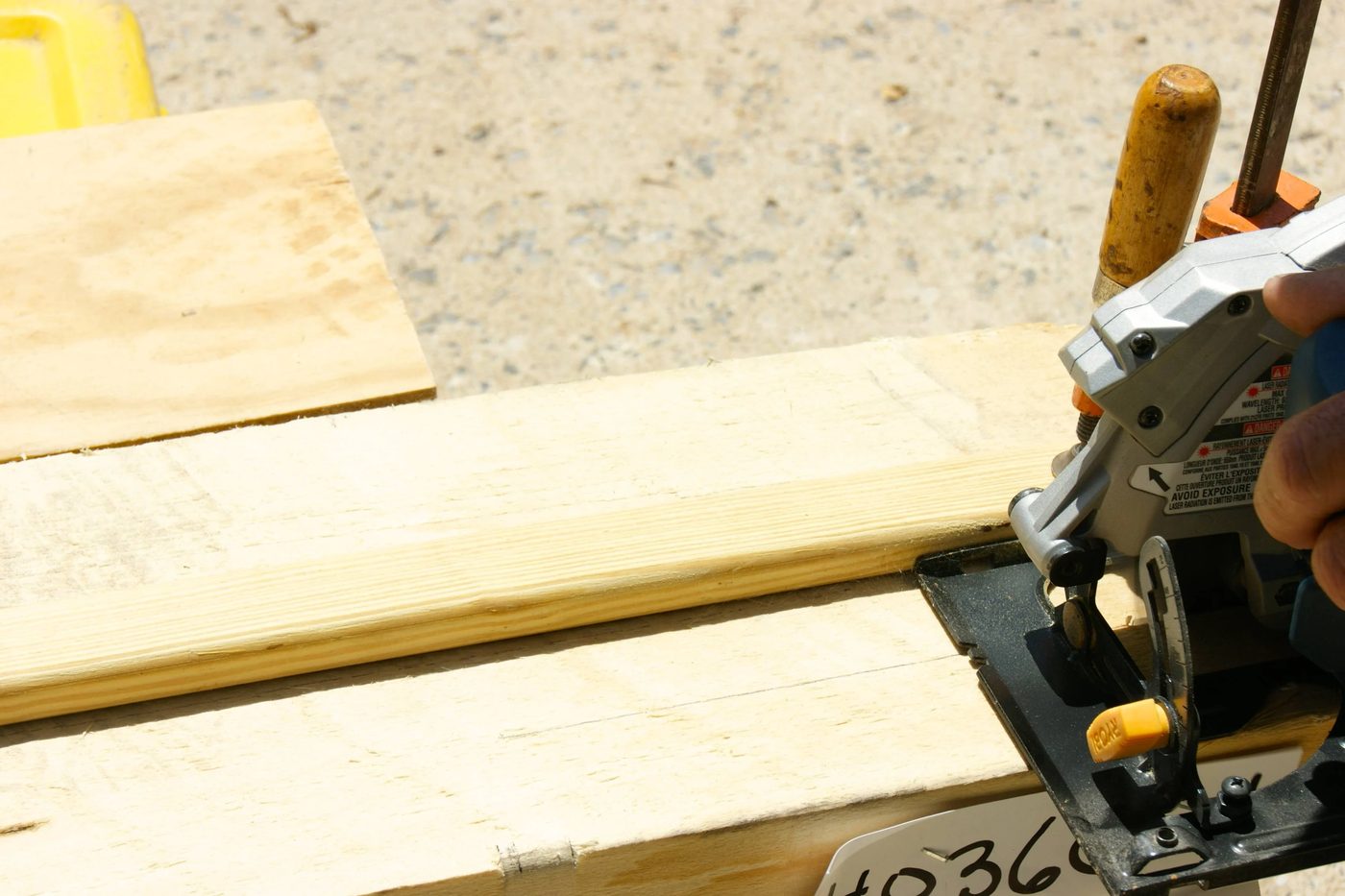 use scrap wood as a guide for cutting a straight line with a circular saw