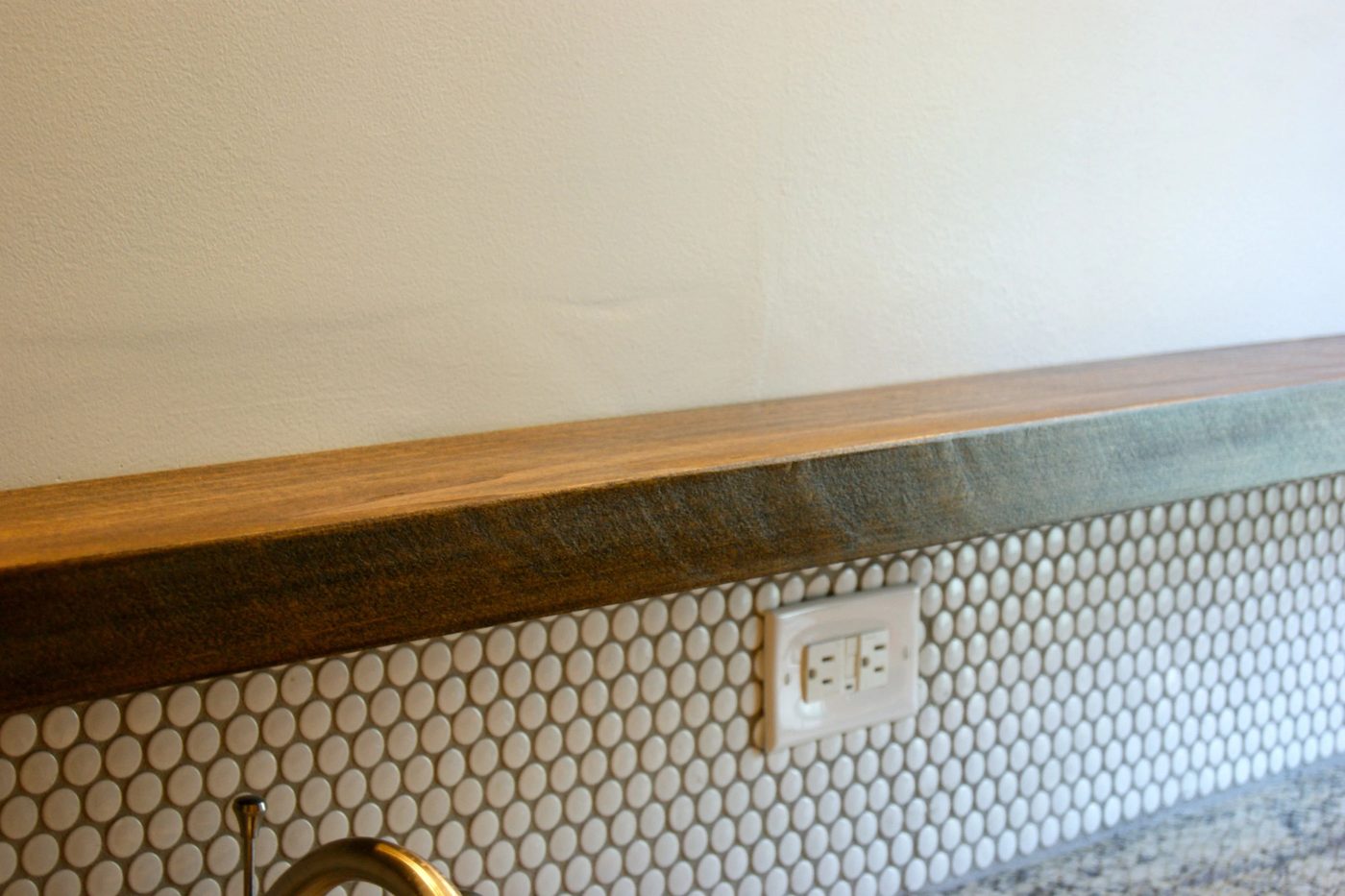 Handmade floating bathroom shelf above vanity below mirror