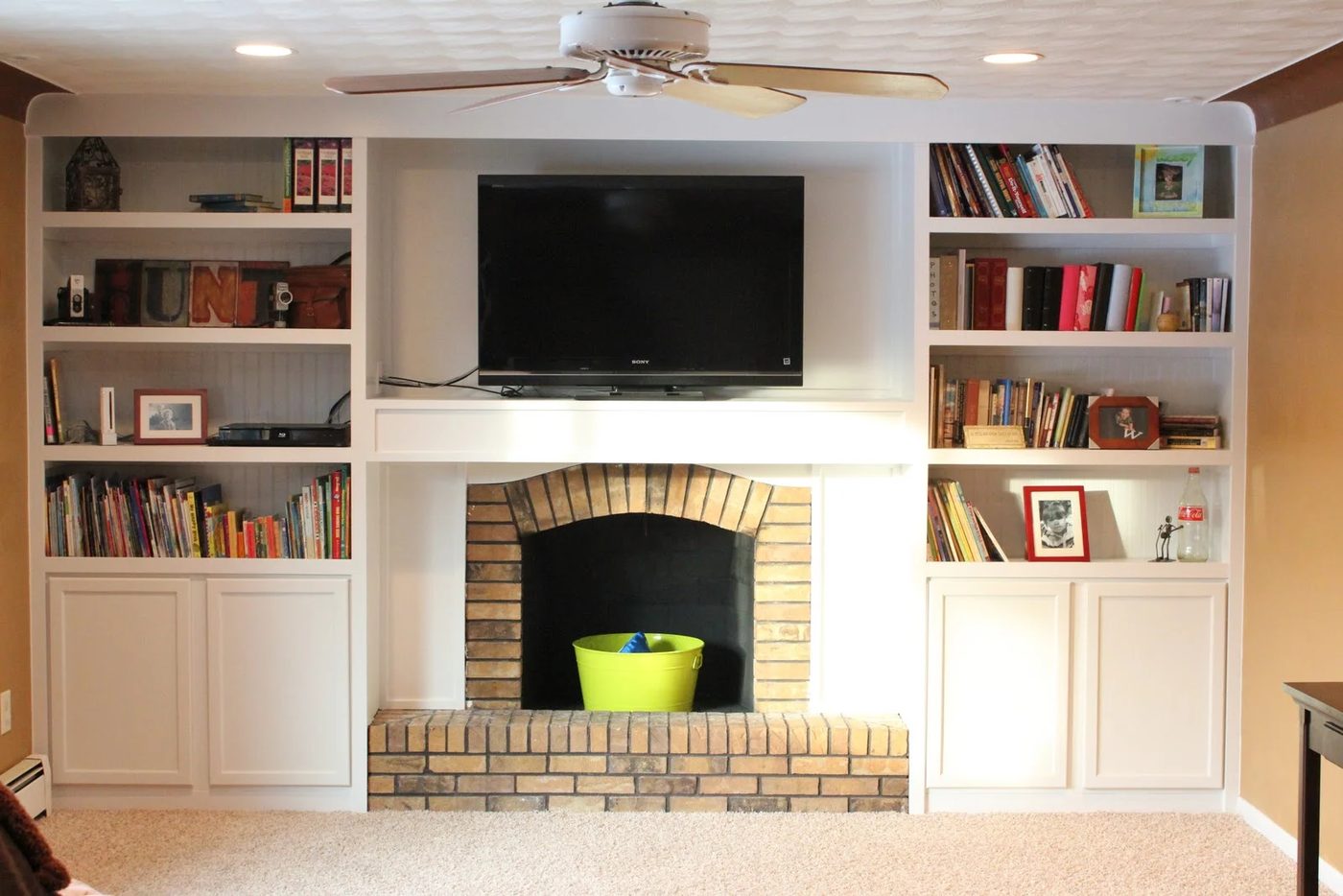 cabinets built in around a fireplace remodel