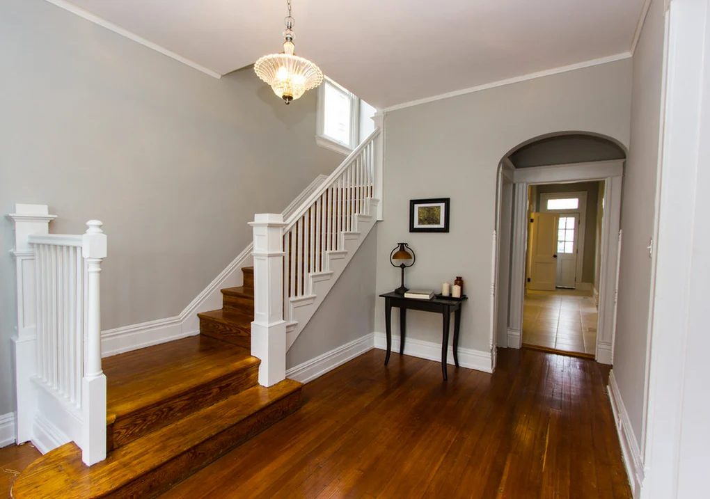 inviting entryway wood staircase makeover by CDG
