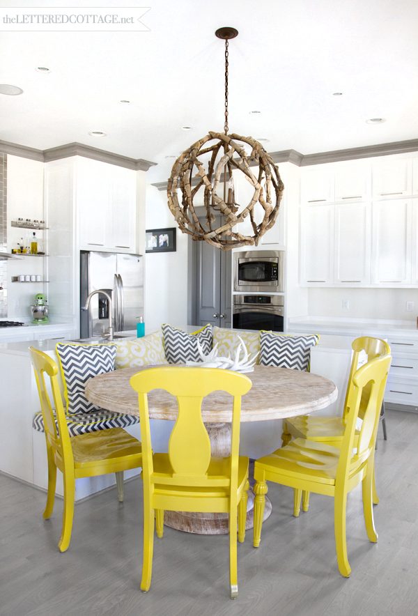 The Lettered Cottage banquette with yellow chairs