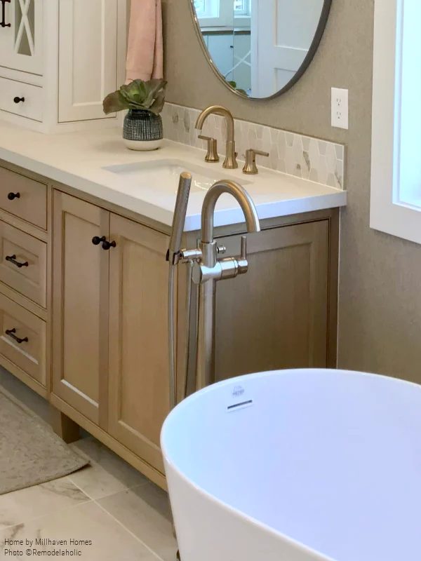 Gold Faucet Fixtures For Sink And Freestanding Tub In Master Bath, Millhaven Homes And Four Chairs Design, 2018 Utah Valley Parade Of Homes Featured On Bekob