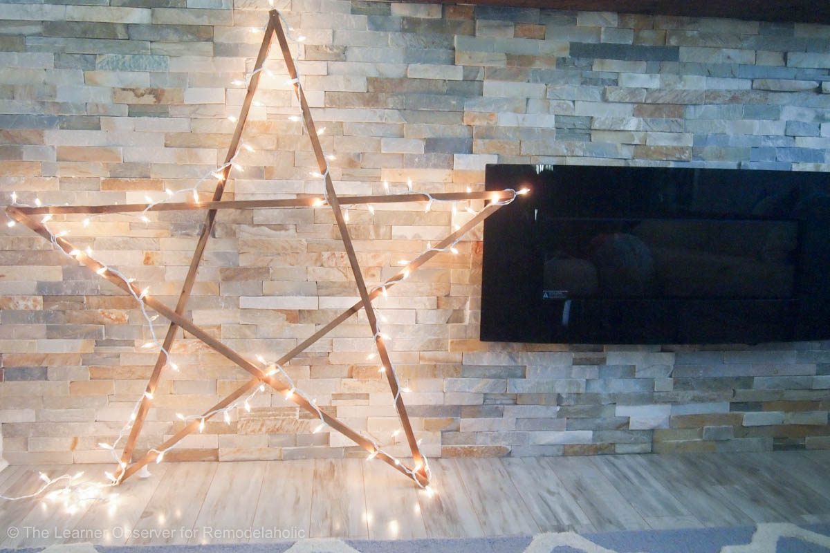 A wooden star with lights.