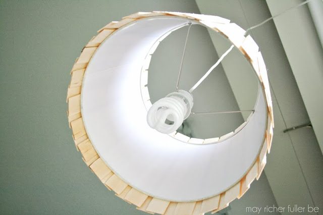 A pendant light made with wood shims.