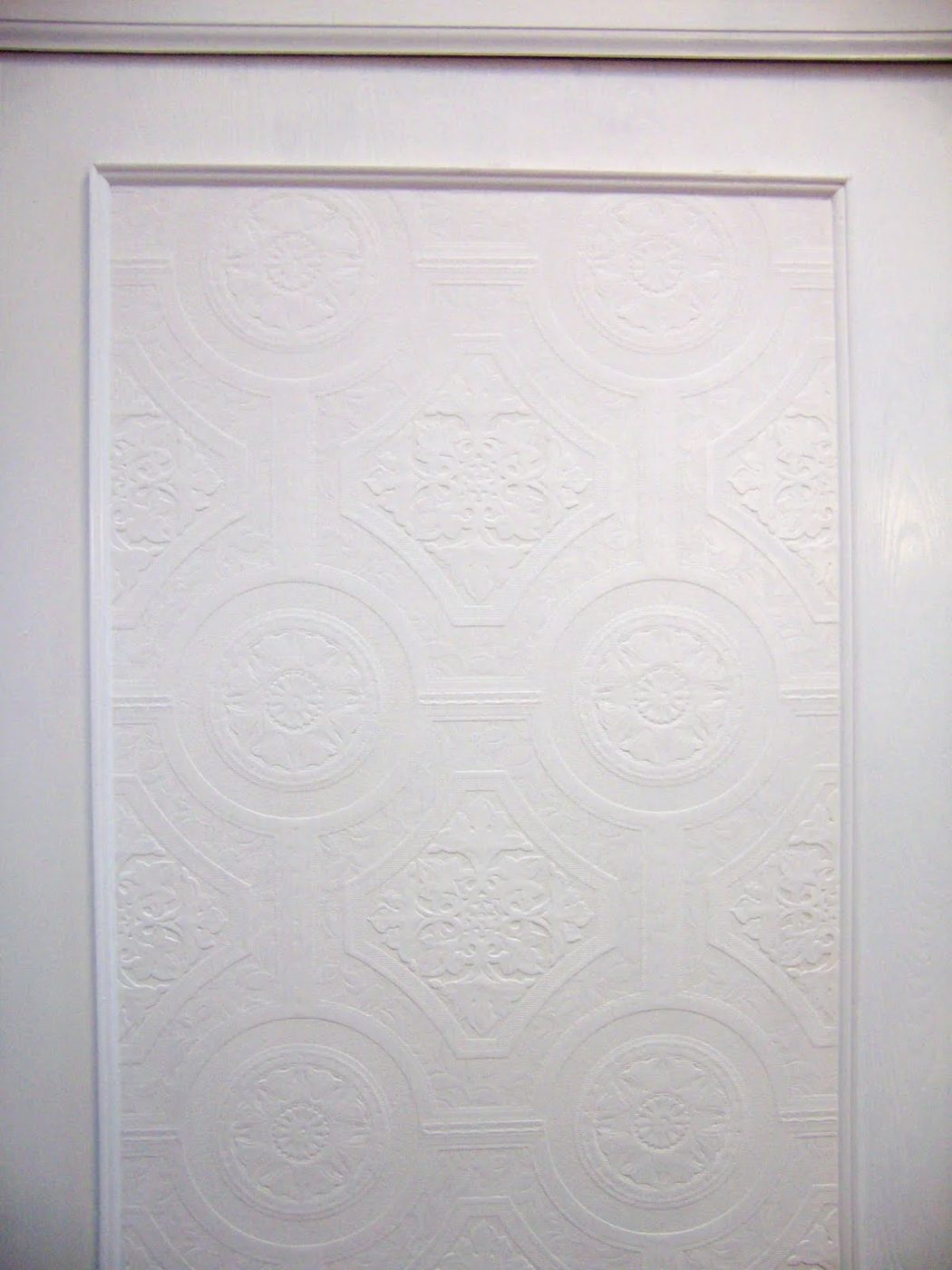 update flat closet doors with trim and textured wallpaper via @Bekob